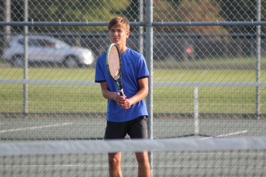 Martin Stoner out playing on the tennis court.