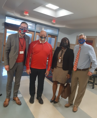 Superintendent Cummings, Mr. Wieczorek, Mrs. Robinson, and Principal Seitz pose for a picture on Wednesday, Oct. 27.