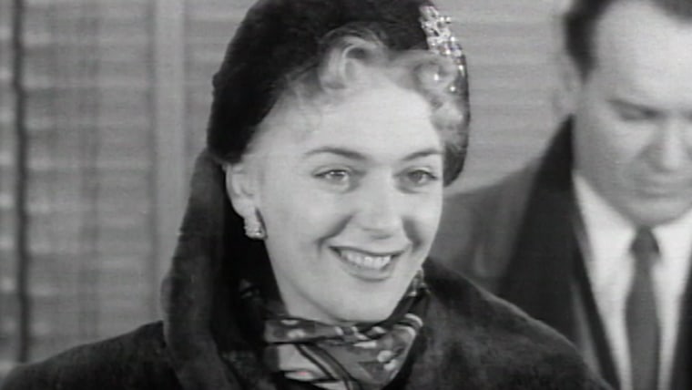 Image shows Christine Jorgensen upon her return to America post operation, 1953. Image sourced from video taken and released by the British Pathe.